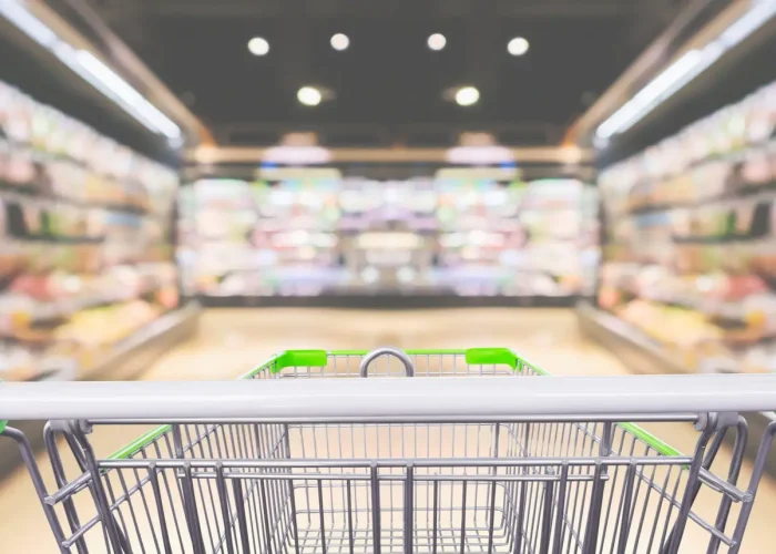 empty shopping cart in supermarket grocery store background empty shopping cart in supermarket grocery store background